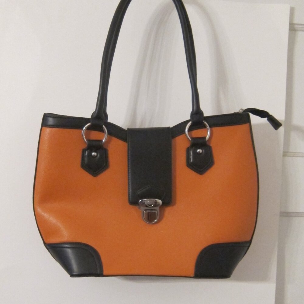 Pumpkin/black vinyl shoulder bag, no maker tag.